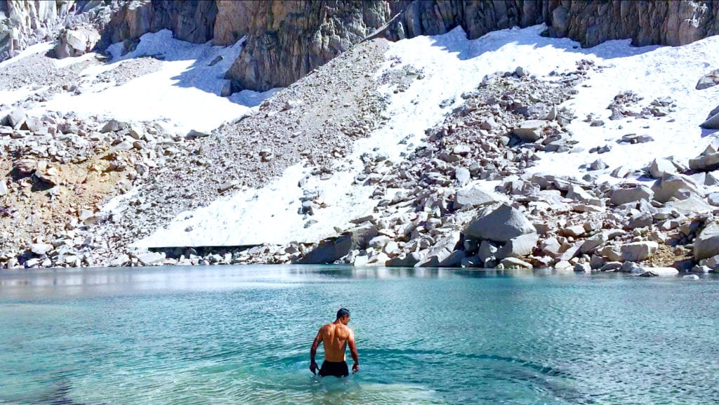 Refreshing dip in alpine waters along the journey